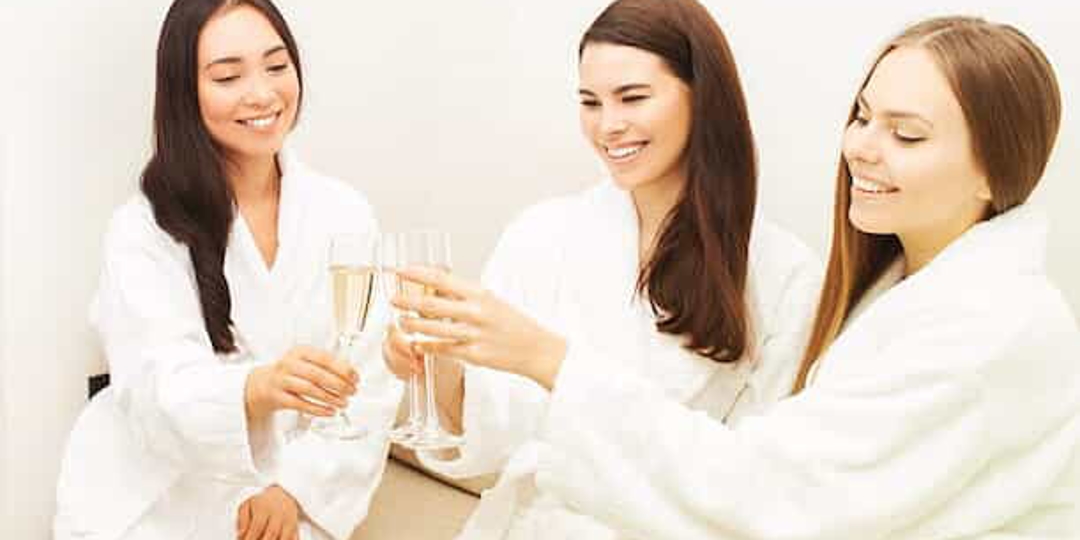 Women enjoying champagne in a day spa