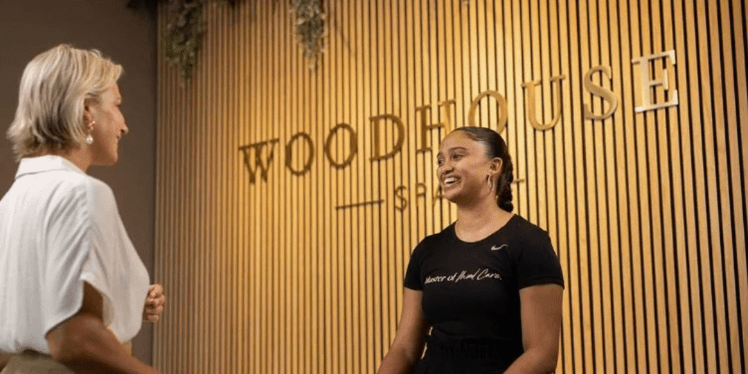 Woodhouse employee smiling at customer